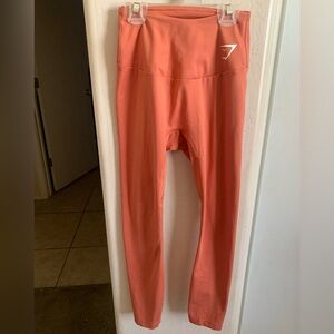 EUC gymshark coral/orange leggings, Size XS